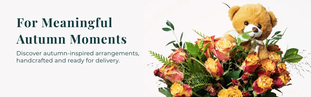 Bouquet of flowers with a teddy bear and text about autumn arrangements.