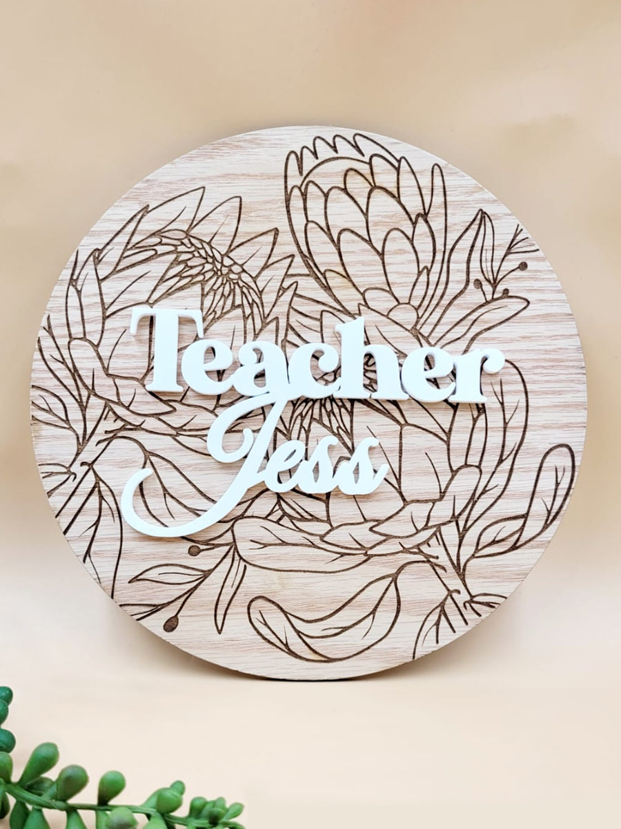Personalised floral wooden plaque with 'Teacher' engraving, made from oak veneer, ideal heartfelt gift or desk ornament.