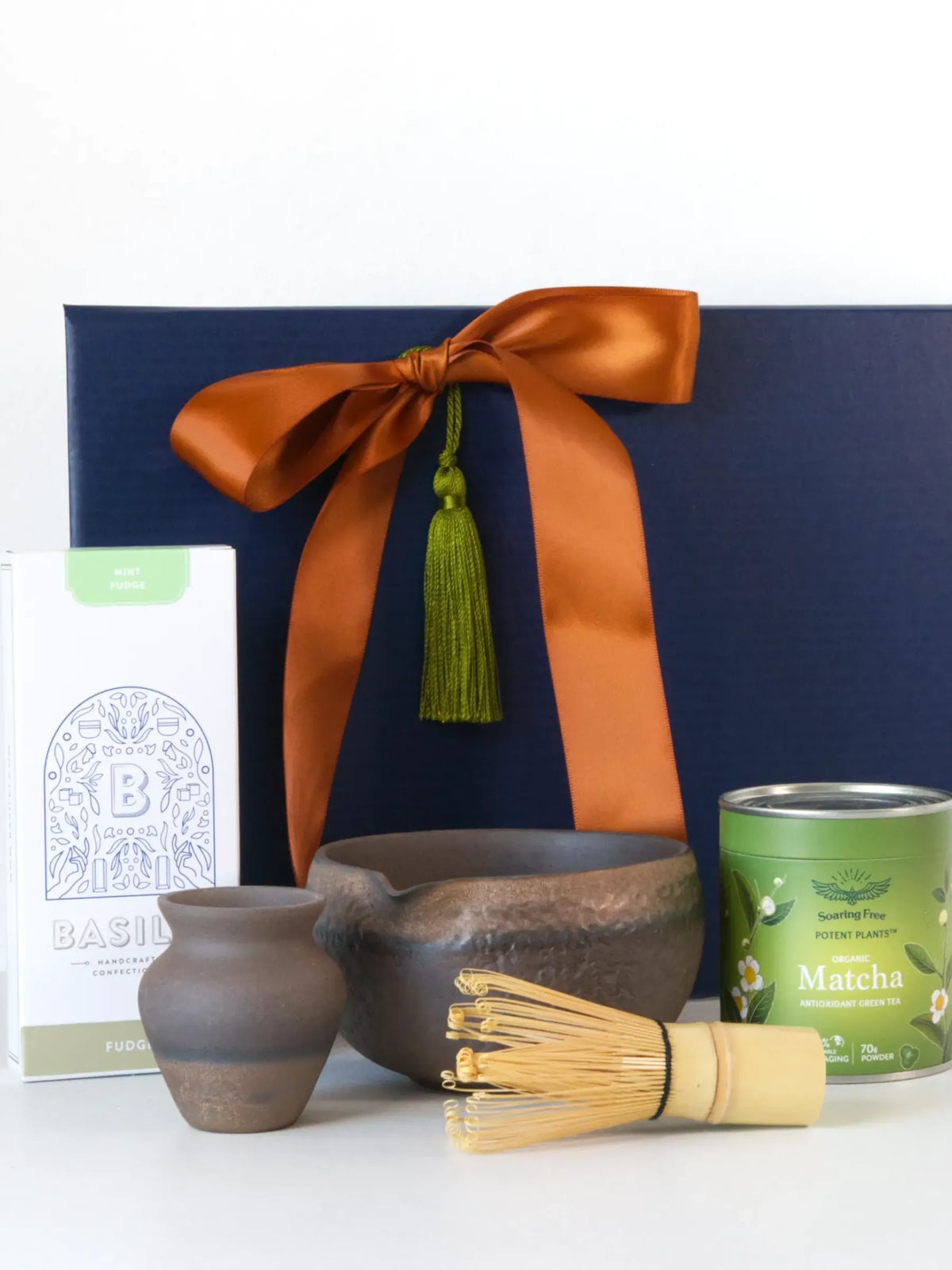 Luxury Mutcho Matcha gift set with Japanese tea bowl, bamboo whisk, organic matcha, and decorative gift box for mindfulness.