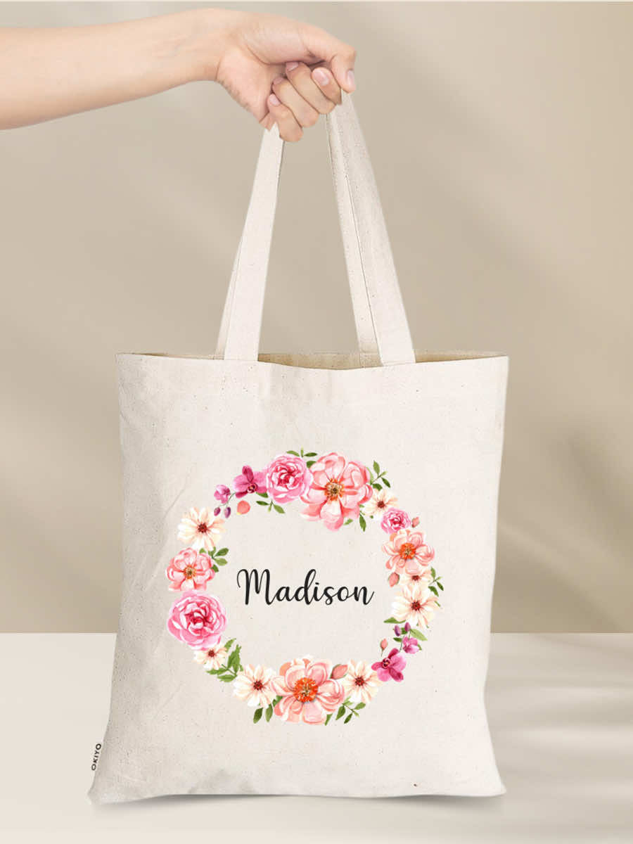 Personalised eco-friendly cotton tote bag with floral design and customizable name, perfect for gifts and everyday use.