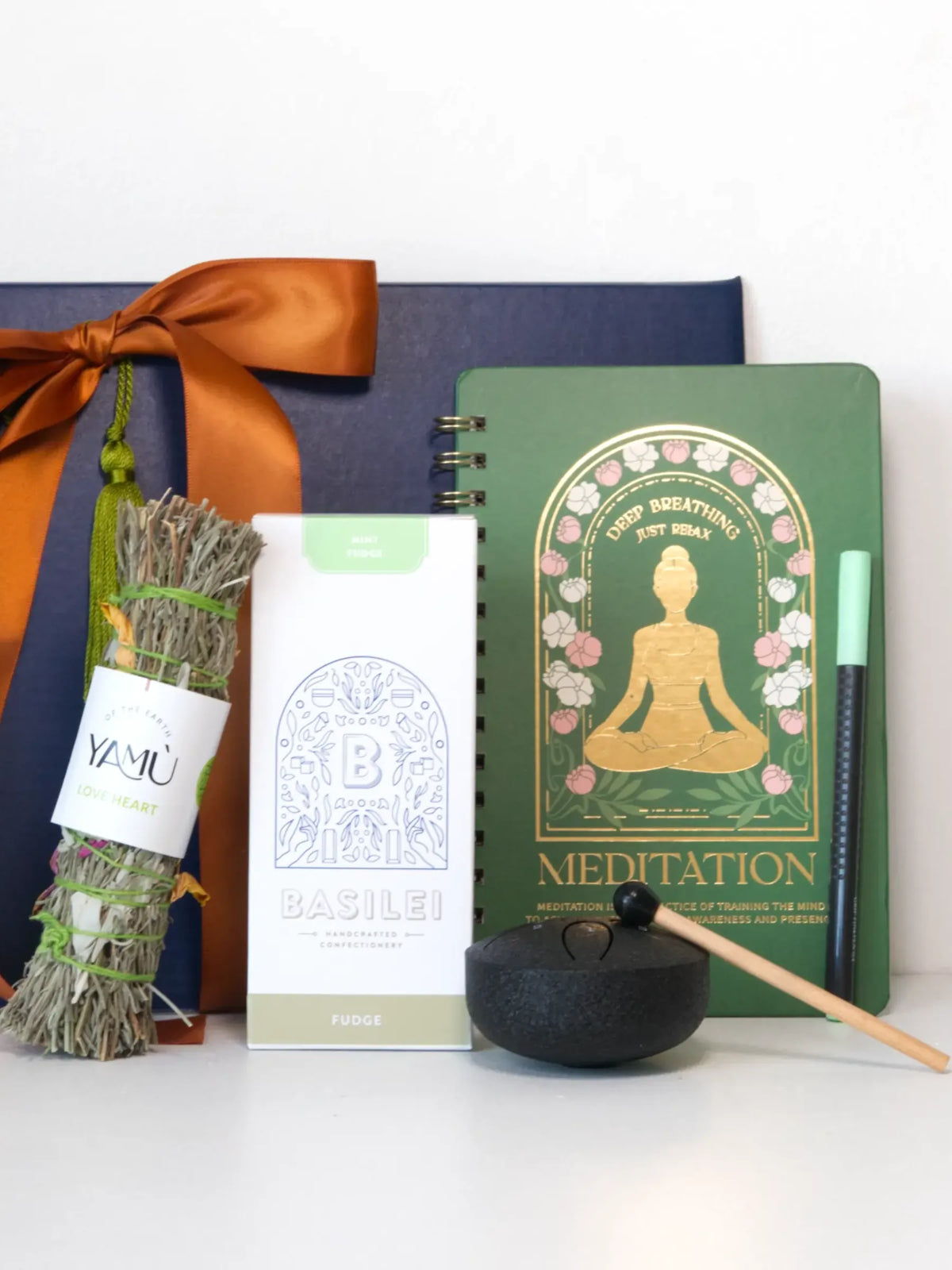 Sage & Song Mindful Gift Set with meditation notebook, smudge stick, incense, and singing bowl for relaxation and self-care.