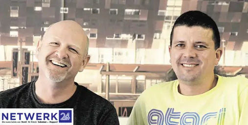 Two men standing side by side with a blurred background featuring the 'Netwerk 24' logo.