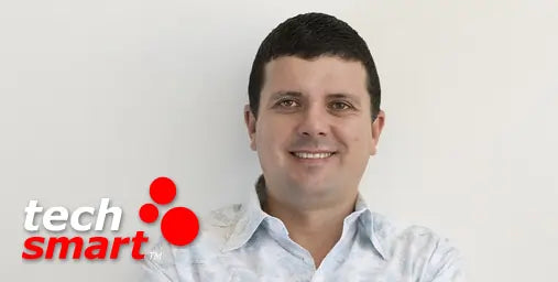 Man smiling with 'tech smart' logo in the corner
