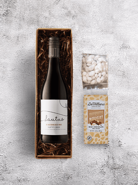 De-alcoholised red wine with macadamia nougat and nuts, a delightful pairing for enhanced flavors on the palate.