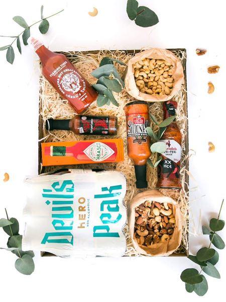 Boys-Night-In gift box with non-alcoholic beers, hot sauces, and luxury nuts, perfect for a relaxing evening or watching the game.