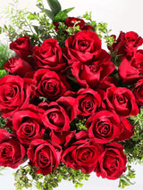Classic red rose bouquet filled with lush blooms and greenery, perfect for Valentine's Day gifts from Bloomable.
