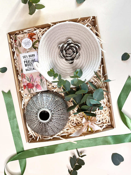 Decorative Delight gift set with Geskenk Stone Vase, Cotton Rope Trinket Bowl, ceramic flower bud, and Winston & Julia Praline Chocolates.