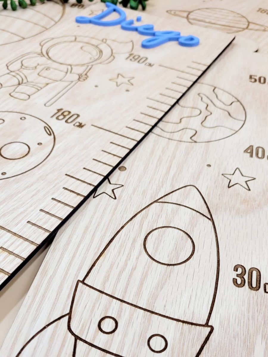 Personalised kids growth chart with rocket and space theme engraved on veneer wood, customized with blue acrylic name, nursery decor.