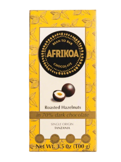 Afrikao chocolate bar packaging with roasted hazelnuts on a white background