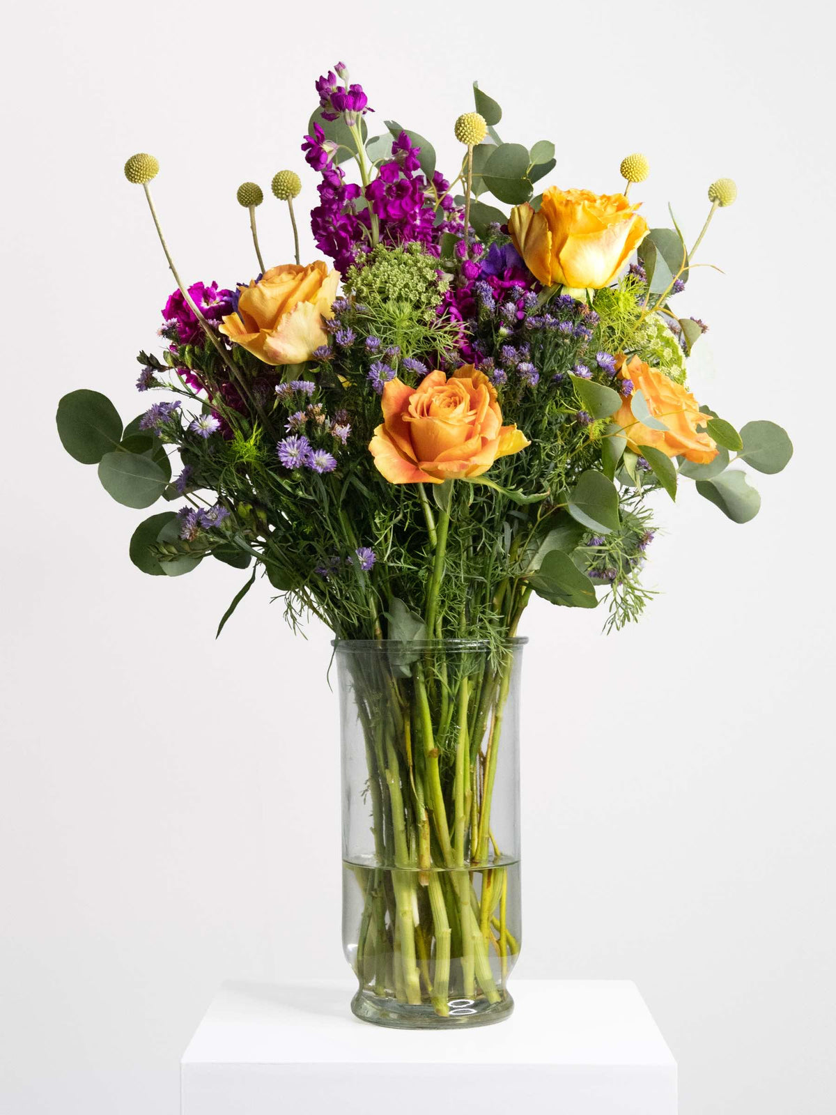 Halloween Boo-quet with orange and purple blooms in vase, perfect for spooky October home décor or party centerpiece
