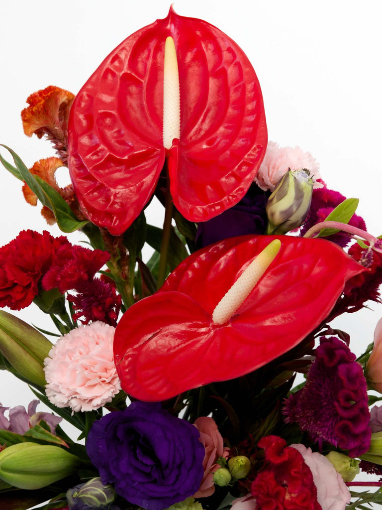 Vibrant 'Just As You Are' Bouquet featuring red anthurium, carnations, and assorted romantic flowers.