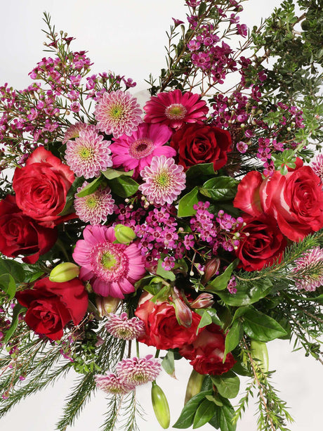 Luxurious pink flower bouquet with pink roses, penny gum, and lush greenery, perfect for gifting happiness on any occasion.