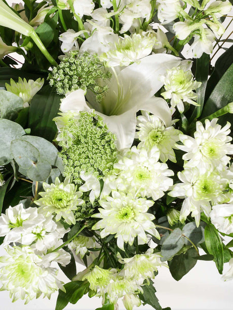 Mixed St Joseph Lily Bunch with seasonal flowers and greenery; vibrant floral arrangement without vase.