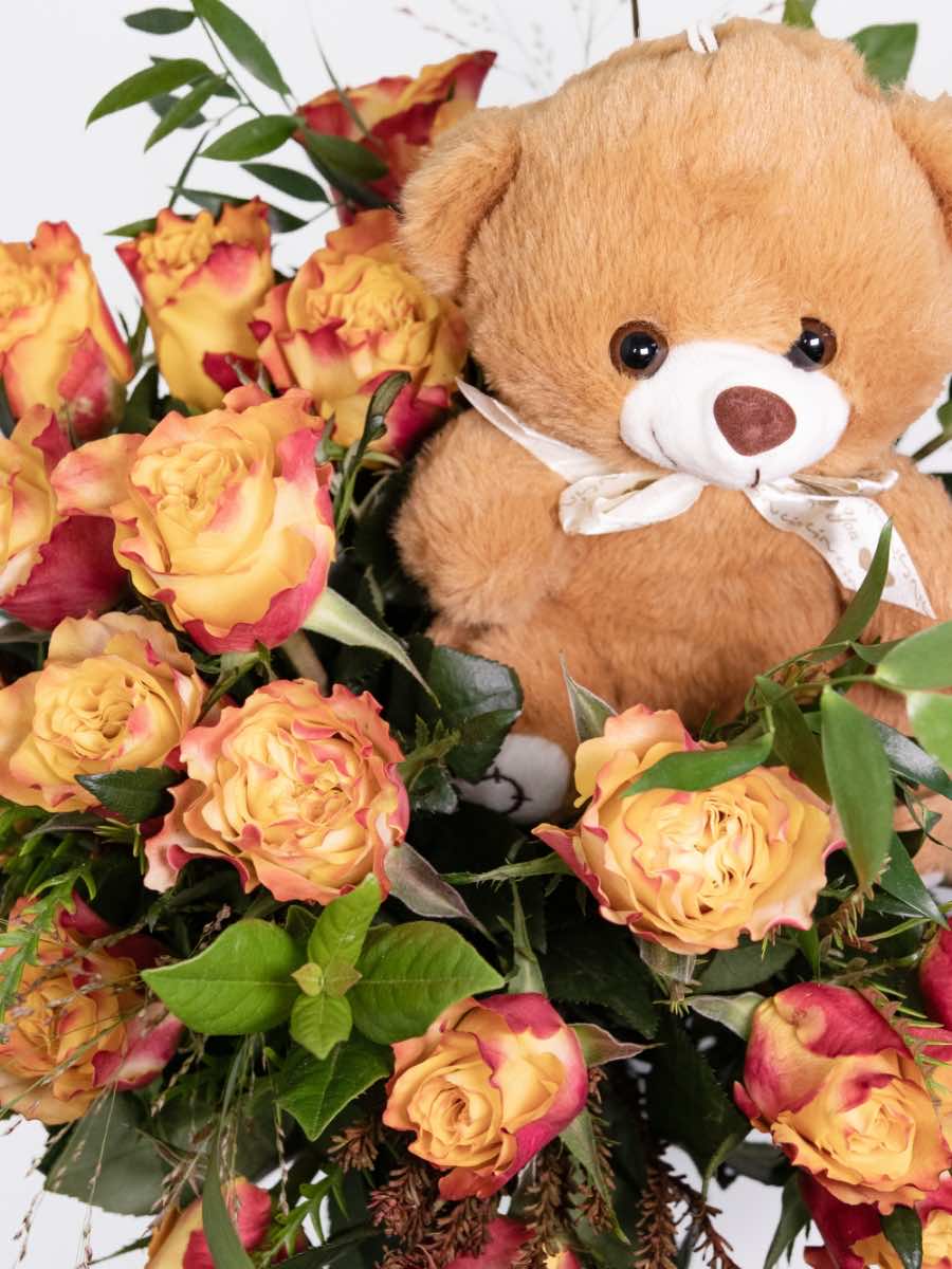 Orange rose bouquet with a cute teddy bear, perfect as a cheerful Valentine's Day gift expressing love and appreciation.