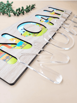 Personalised kids puzzle with clear acrylic letters and colorful printed background on oak veneer wood base