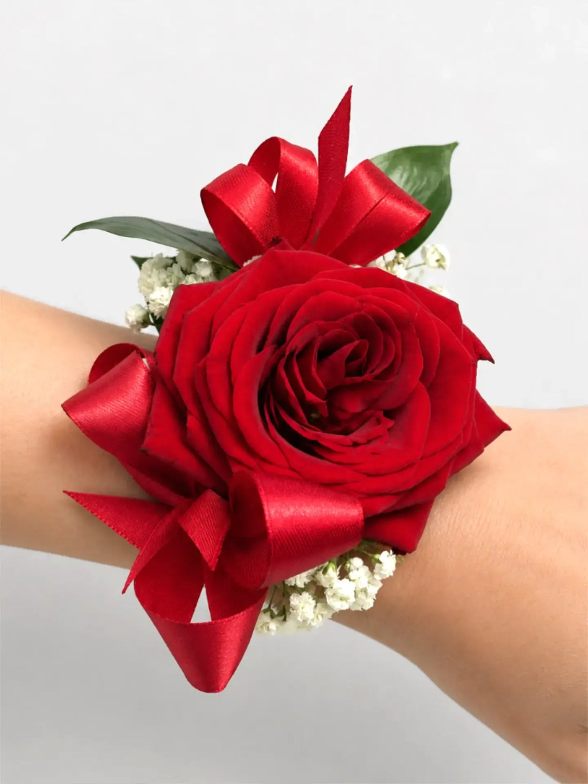 Wrist Corsage with Red Roses, Ribbon, Sprigs of Gypsophila and Greenery