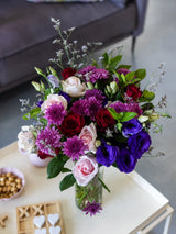 Bouquet of flowers in a vase on a table with a blurred background