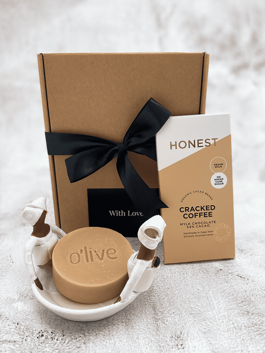 Gift box with Honest cracked coffee chocolate, Olive natural soap, and decorative bowl, representing unity and quality ingredients.