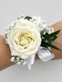Wrist Corsage with White Rose, Sprigs of Gypsophila, Ribbon, and Greenery