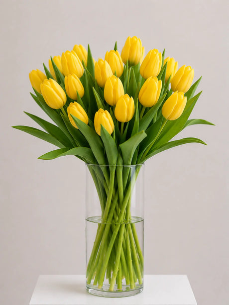 Yellow Tulips in a glass vase. The perfect seasonal gift for Autumn and Winter.
