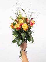 Orange rose bouquet with greenery by local South African florists, demonstrating the Heart & Soul of small business. Seasonal variations apply.