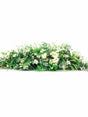 Coffin or Casket Spray of mixed seasonal flowers and greenery for memorial and funeral services.