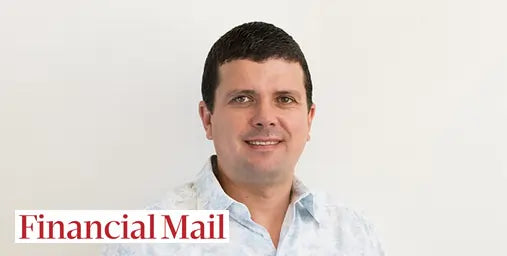 Man wearing a white shirt with 'Financial Mail' logo on a white background