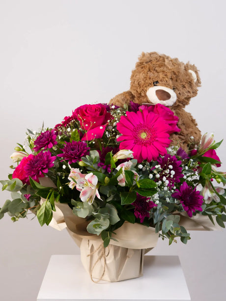 Pink mixed flower posy with gerbera, roses and chrysanthemums with brown teddy bear gift