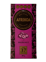 Afrikoa 80g milk chocolate bar with hazelnuts, 37% cocoa, pink and brown packaging, award-winning, crunchy snack.