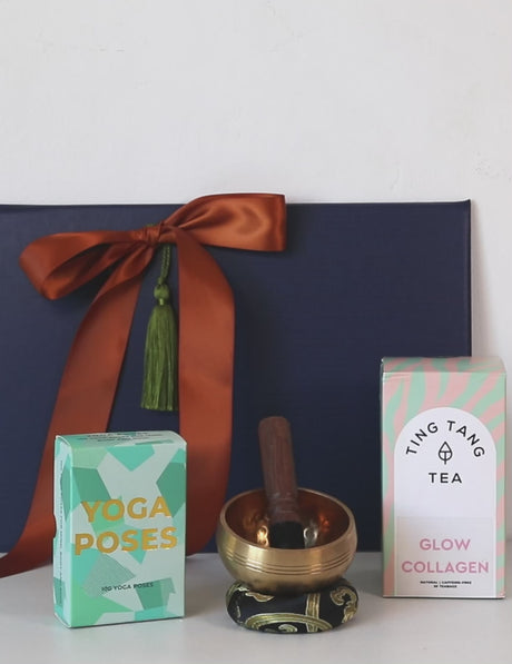 Yoga Serene Calm & Flow Gift Set with yoga poses cards, collagen tea, and meditation bowl, promoting mindfulness and relaxation.
