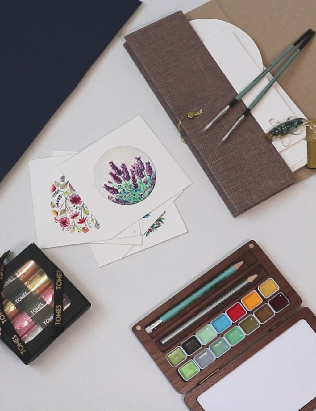 Watercolour Moments Creative Gift Set including paints, brushes, and artistic designs, perfect for mindfulness and creativity.