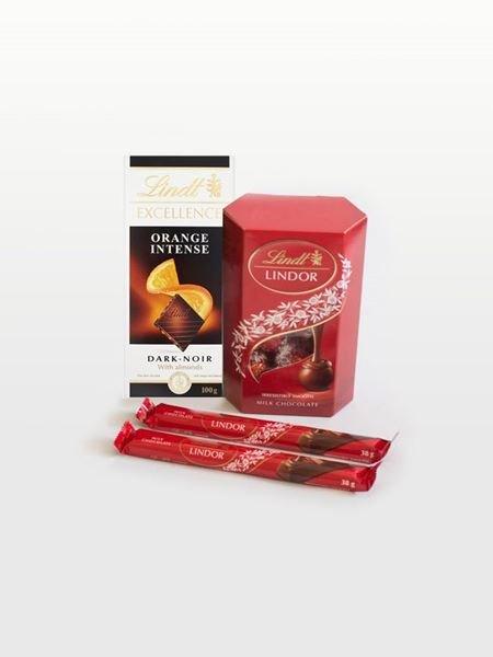 Lindt chocolate gift set with Lindor milk chocolate box, orange dark chocolate bar, and Lindor chocolate sticks. Perfect gift idea.