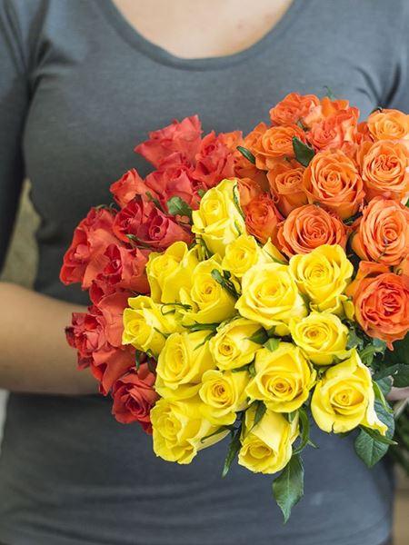 Bright rose bouquet with 15 dark orange, 15 light orange, and 15 yellow roses, wrapped in kraft paper, perfect for any celebration.