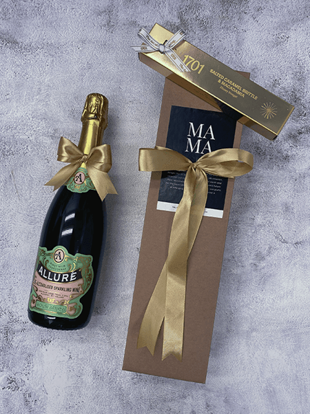 Allure non-alcoholic Pinot Noir Chardonnay with 1701 salted caramel brittle in eco-friendly gift box.