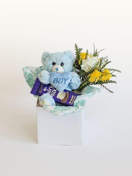 Gift box featuring a blue teddy bear labeled 'Boy' with chocolates and yellow flowers, part of Celebrate A Birth range for baby boys.