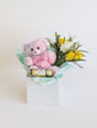 Celebrate a Baby Girl with Ferrero Rocher, teddy bear, and flowers in a decorative box, perfect for a special gift.