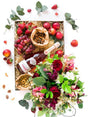Vegetarian gift box with nuts, nectarines, strawberries, and non-alcoholic champagne, accompanied by a floral arrangement.