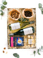 Luxury gift box with non-alcoholic wine, Ferrero Rocher chocolates, luxury nuts, and nougat, perfect for congratulating couples.