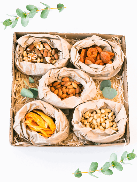 Luxury dried fruit and nuts snack box with cashews, almonds, mixed nuts, dried mango, and apricots. Vegan gift box.