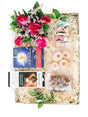 Joyful Gift Box with pink roses, strawberry biscuits, nougat, biltong, liquorice allsorts, and Lindt chocolate on decorative straw.