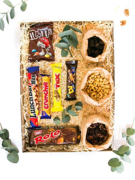 Gift box with assorted sweet and savoury snacks including biltong, nuts, M&M's, Rolo, Crunchie, Tex, and Snickers chocolate bars.
