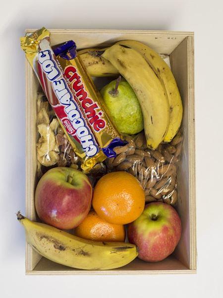 Snack Pack: Healthy mix of fruits, nuts, Cadbury Crunchie, and chocolates in a hamper. Includes apples, bananas, and mandarin. Perfect treat.